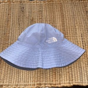 Reversible toddler The North Face bucket hat.
